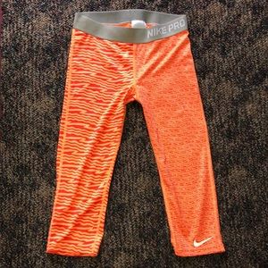 Orange Nike Pro leggings
